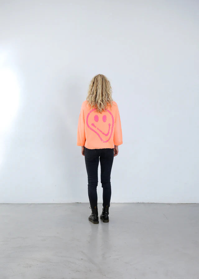 SWEATSHIRT NIKITA SMILEY VON OUTRYGHT IN NEON ORANGE MZ#00667